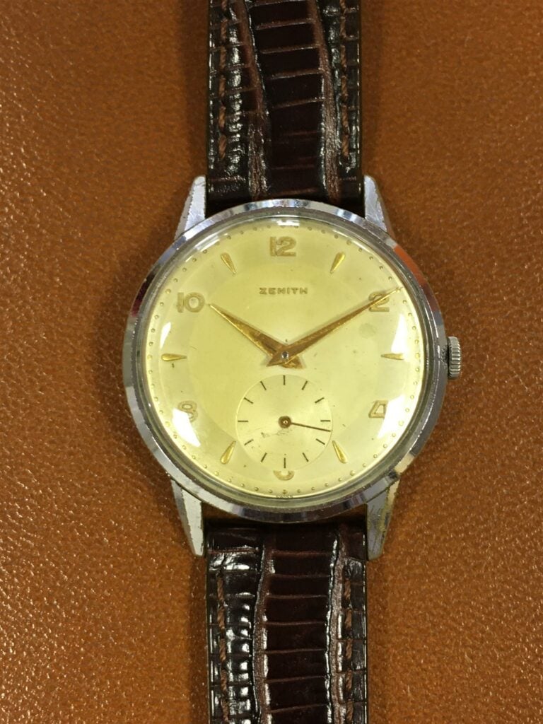 ZENITH. - Montre-bracelet d'homme, boitier en acier, cadran blanc patiné, index…