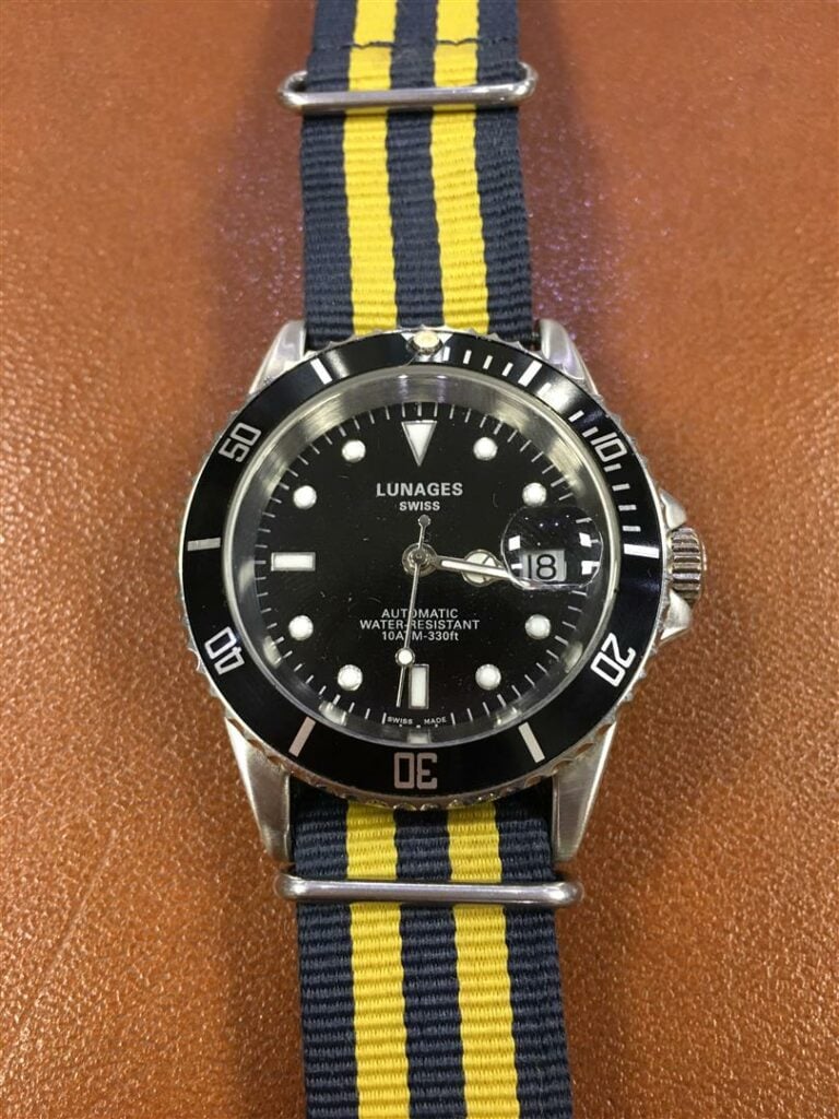 LUNAGES. - Montre-bracelet d'homme type Submariner, boitier en acier, cadran à…
