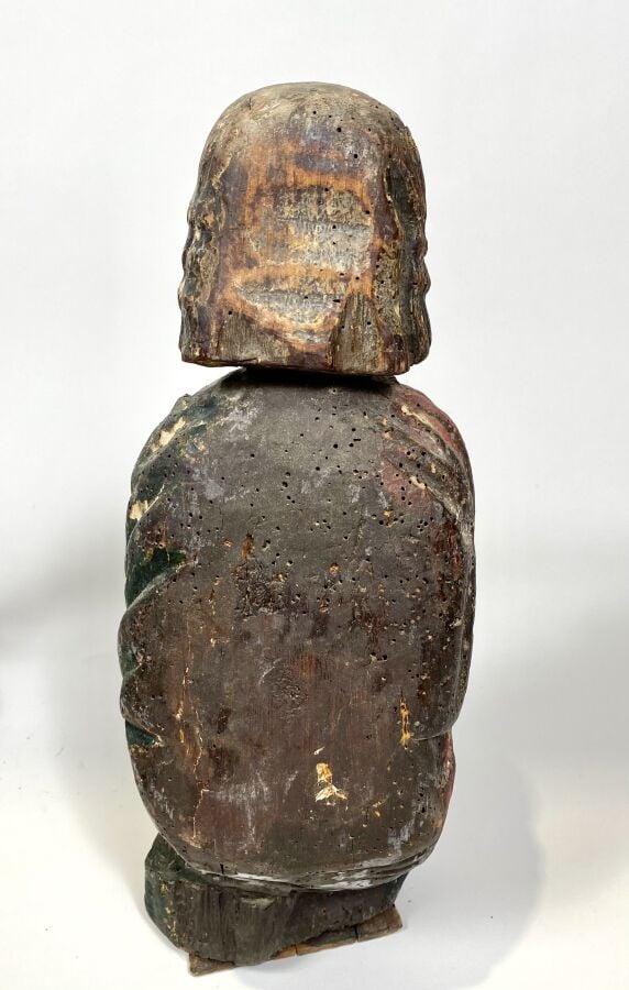 BENITIER en bois sculpté d'une tête d'angelot dans une couronne laurée sur un f…