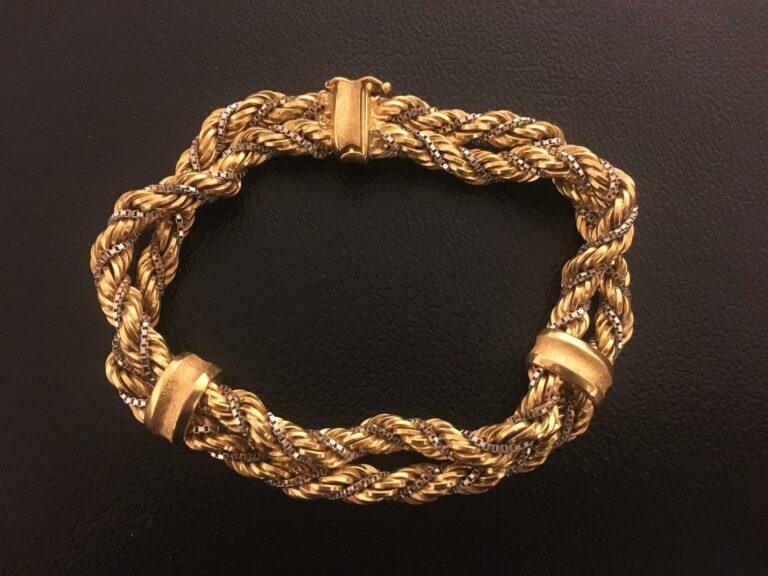 Parure comportant un collier et un bracelet à deux rangs en or jaune 750/1000 t…