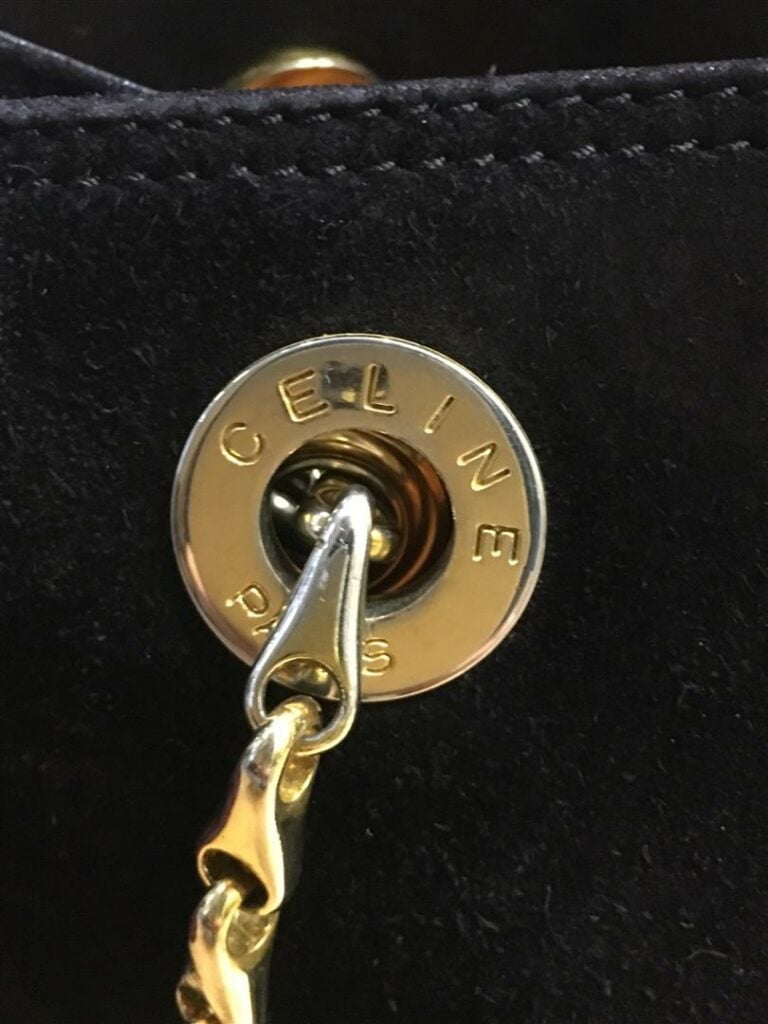 Petit sac bourse CELINE en peau noire, double anse chaîne dorée et cuir, intéri…