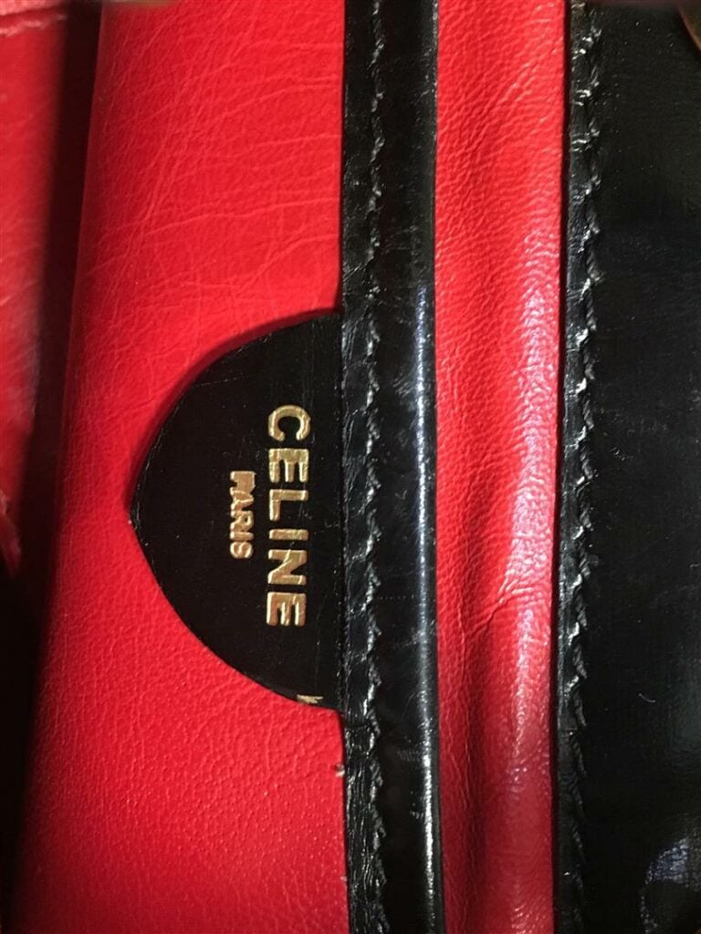 Petit sac bourse CELINE en peau noire, double anse chaîne dorée et cuir, intéri…