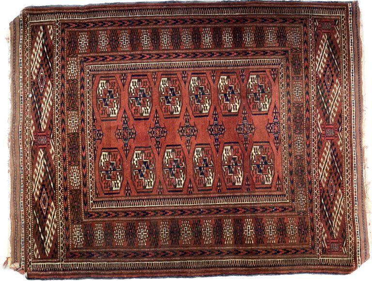 BOUKHARA - Tapis en laine à décor de médaillons et motifs géométriques sur fond…