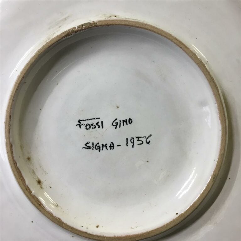 Gino FOSSI (XXème siècle). - Paire de plats en faïence, présentant sur le bassi…