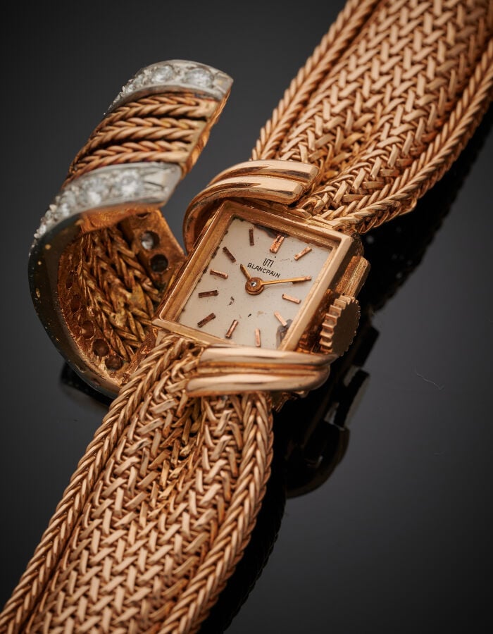BLANCPAIN - UTI - BRACELET MONTRE « noeud » de dame en or jaune (750‰). La mont…