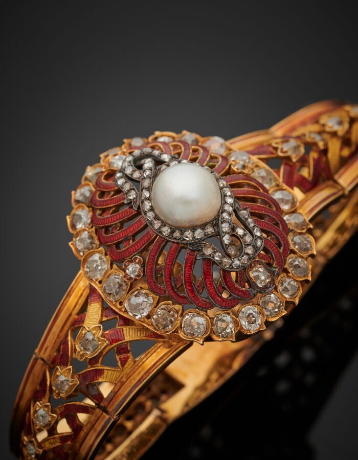 BRACELET semi-rigide ouvrant en or jaune (750‰) et argent (min. 800‰) repercé,…