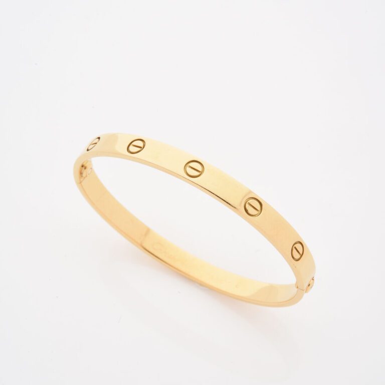 CARTIER - Bracelet rigide ouvrant modèle Love en or jaune (750) décoré de motif…