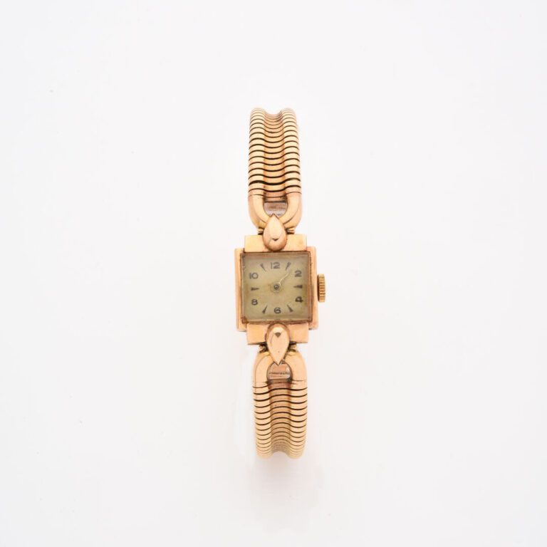 Montre bracelet de dame en or jaune (750), boîtier rectangulaire légèrement bom…