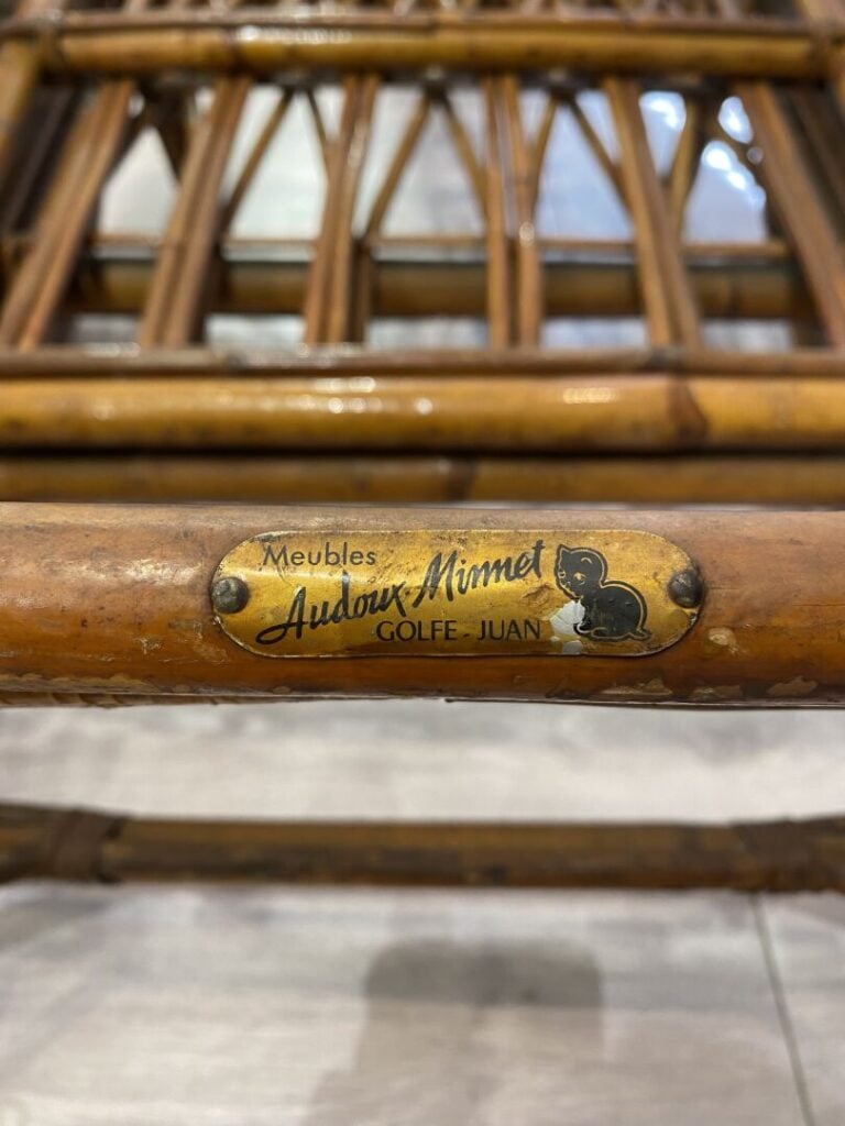 AUDOUX-MINET, Golfe-Juan - Paire de fauteuils en rotin teinté, les accotoirs co…
