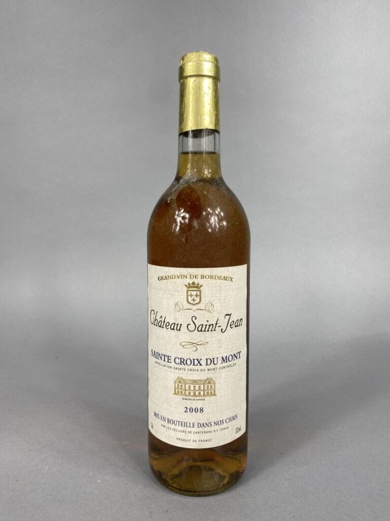 Ensemble de quatre bouteilles comprenant : - - Château Saint-Jean, Sainte Croix…