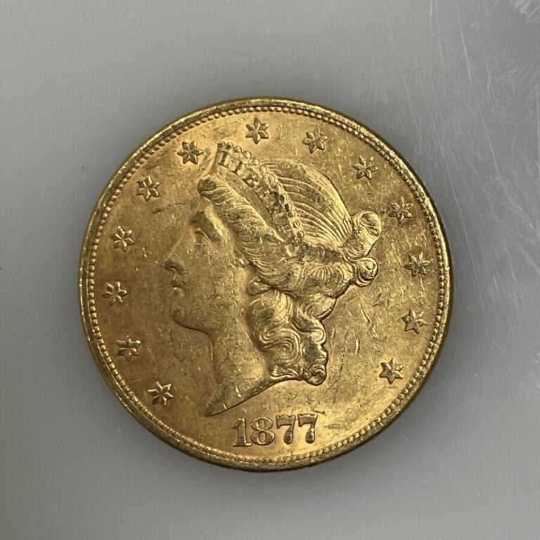 Une pièce de 20 Dollars en or (900‰) "Liberty Head - Double Eagle" - 1877 - 33.…