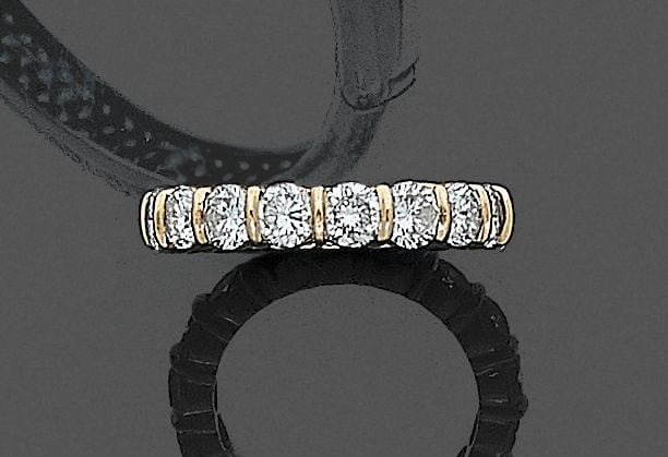 •ALLIANCE en or jaune (750‰) serti de 17 diamants taille brillan