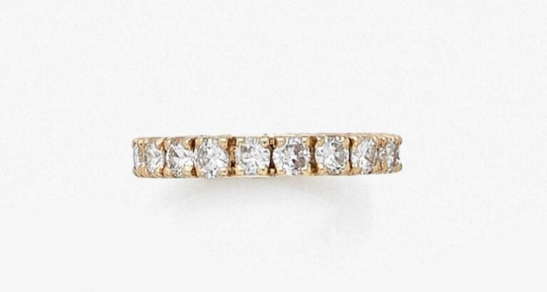 •ALLIANCE en or jaune (750‰) serti de vingt diamants taille brillan