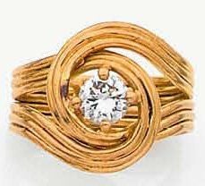 BAGUE en fil d'or jaune ajouré serti d'un diamant de taille brillan