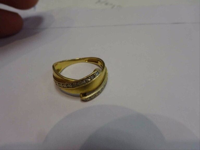 Bague jonc croisé en or deux tons 18K (750°/00) sertie de diamant