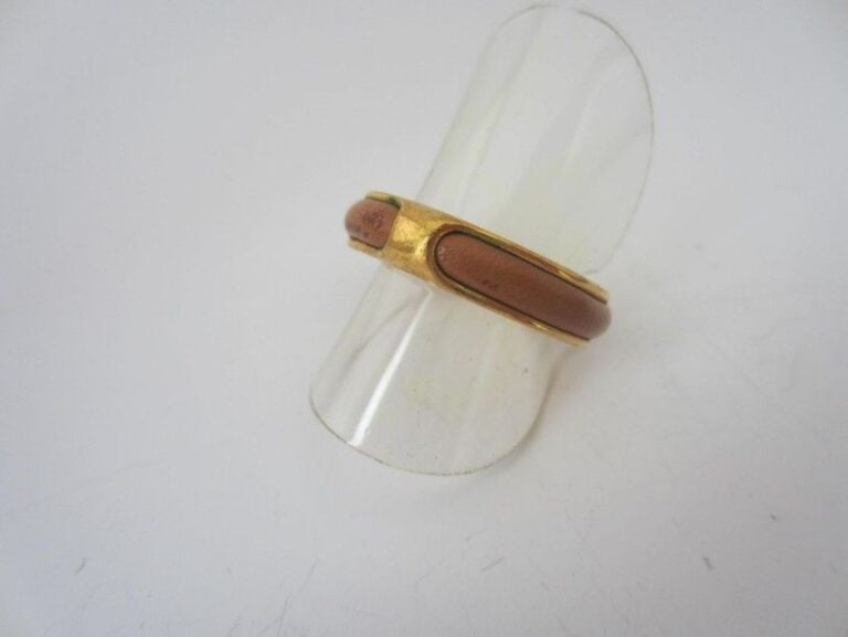 BAGUE ouverte en métal doré et cui
