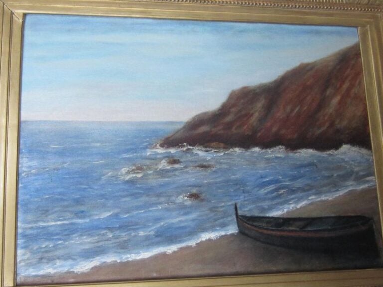 BARQUE EN BORD DE MER