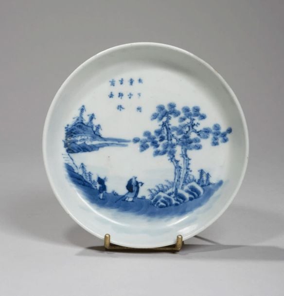 Bol en porcelaine à décor en bleu sous couverte d'un couple d'oiseaux perché sur des branches fleurie
