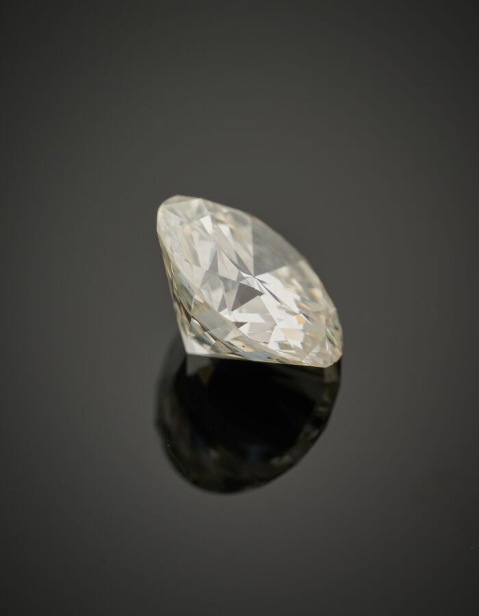BOUCHERON - BAGUE en platine (950‰) à motif rayonnant, serti d'un diamant pesan…