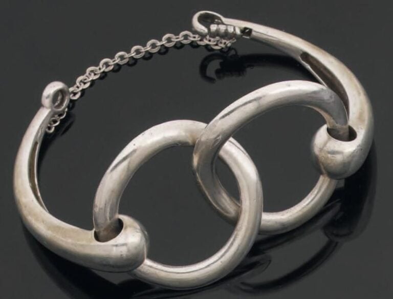BRACELET articulé en argent, à deux motifs circulaire
