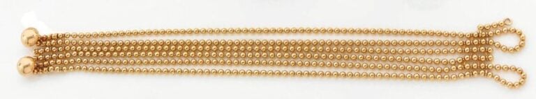 BRACELET « collection Draperie » en or jaune composé de six rangs de boules d'o