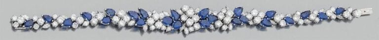 BRACELET en or gris (750 millièmes) serti de saphirs de taille poire, navette et brillant, en chut