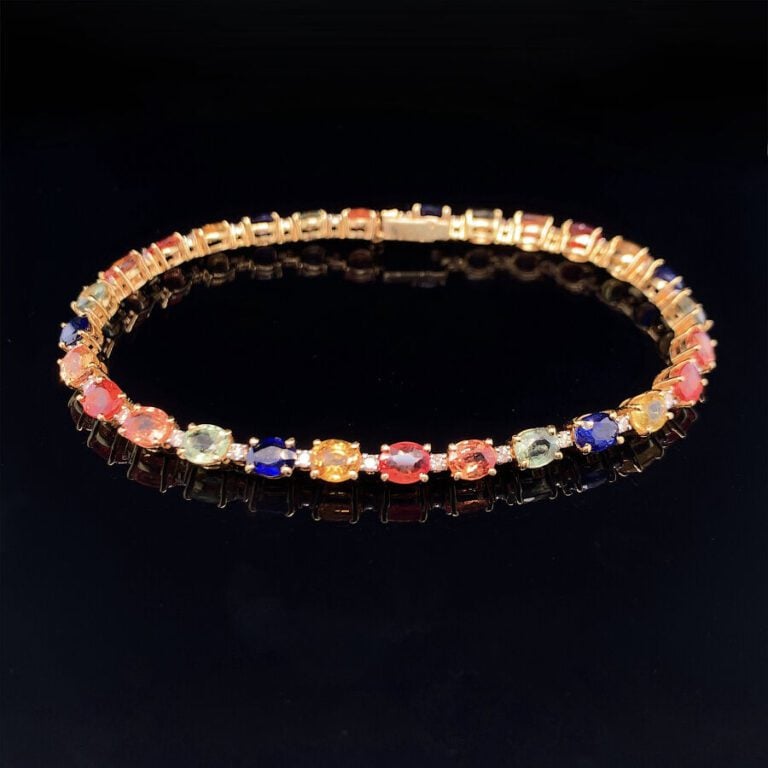 BRACELET en or jaune (585‰) 14 carats, serti de saphirs multicolores de forme o…