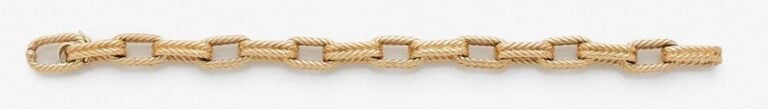 •BRACELET en or jaune (750‰) à maille oblongue tressé