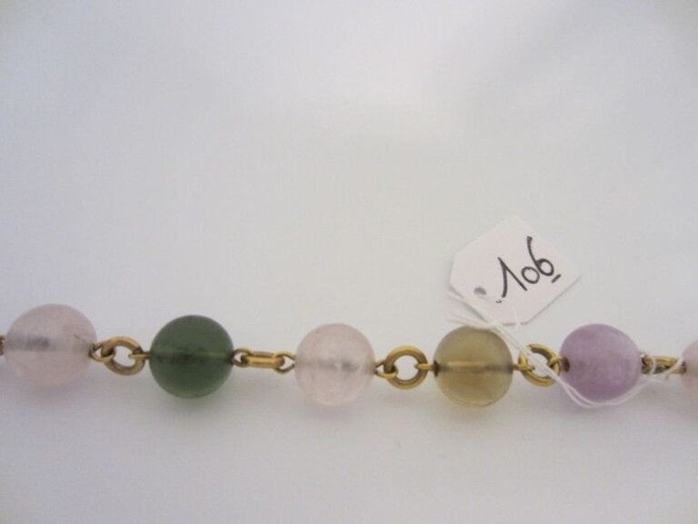 BRACELET en or jaune (750 millièmes) composé de perles de quartz et tourmaline