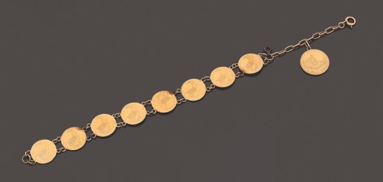 BRACELET en or jaune (750 millièmes) retenant neuf pièces ottomanes en or jaune (900 millièmes) dont:
