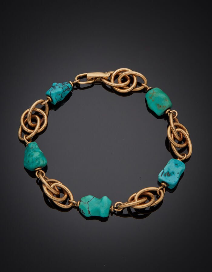 BRACELET en or rose (585‰) 14 carats, à maillons ovales imbriqués alternés de c…