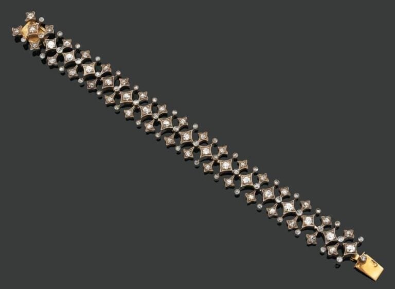 BRACELET «frise» articulé en or jaune et argent ajouré serti de diamants taille ancienne et de rose