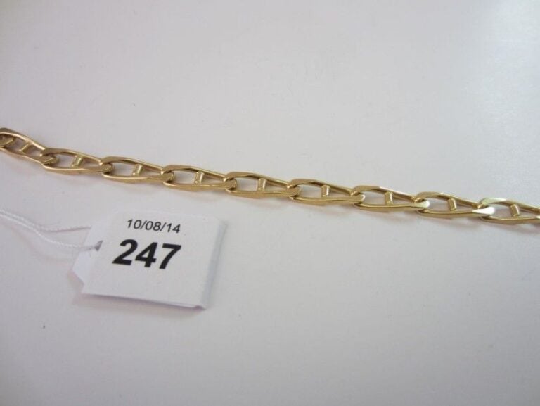 BRACELET gourmette limée en or jaune (750 millièmes) à maillons ovale