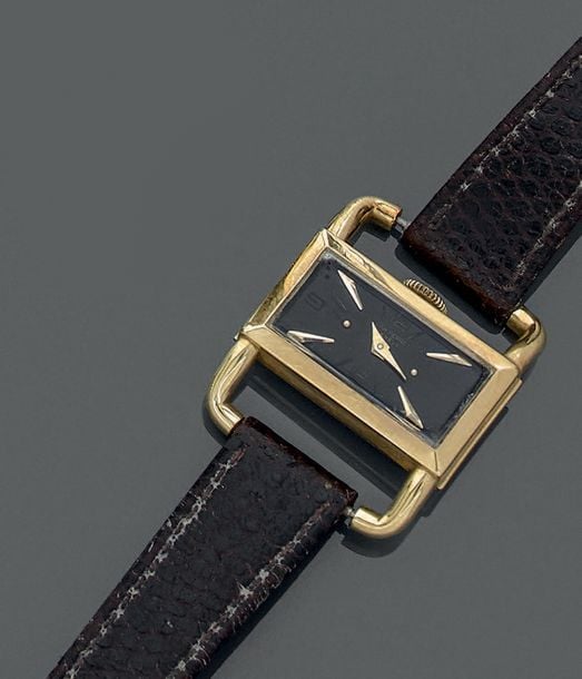 BRACELET MONTRE «arceau» rectangulaire de dame or jaune (750 millièmes