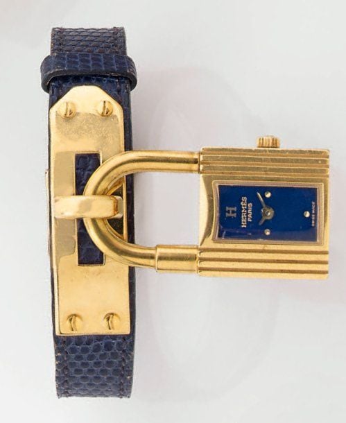 BRACELET MONTRE « cadenas » rectangulaire en métal doré partiellement rainur