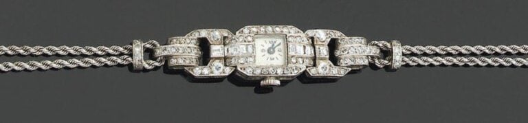BRACELET MONTRE de dame, carrée, en platine et or gri