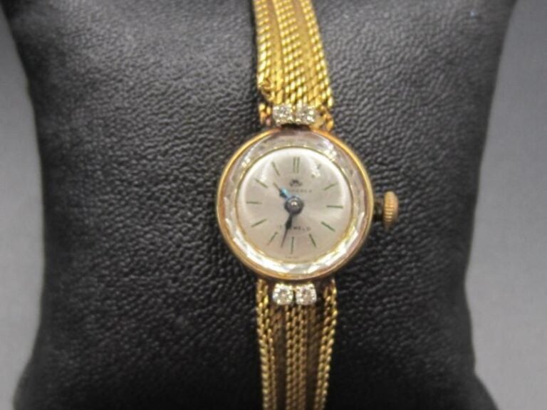 BRACELET MONTRE de dame en or jaune (750 millièmes
