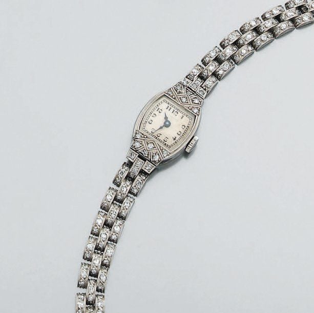 BRACELET MONTRE de dame en platine ciselé et or jaun