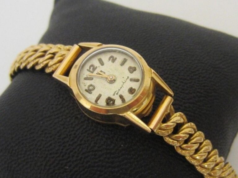 BRACELET MONTRE de dame ronde en or jaune (750 millièmes