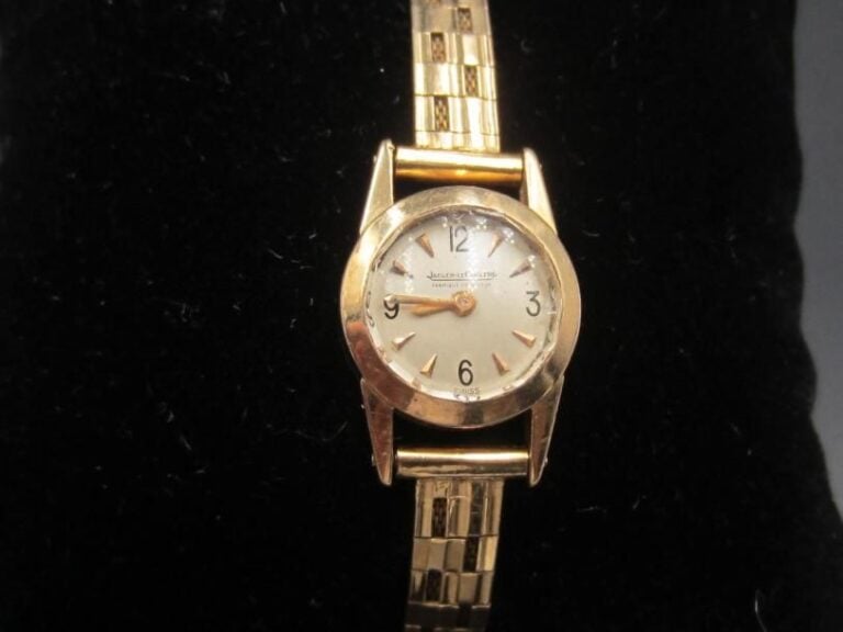 BRACELET MONTRE de dame ronde en or jaune (750 millièmes