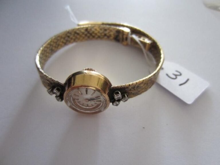 BRACELET MONTRE de dame, ronde, en or jaune et or gri