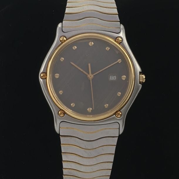 BRACELET MONTRE en or jaune (750 millièmes) et acier, modèle «Classic