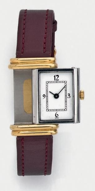 BRACELET MONTRE rectangulaire de dame en or jaune (750 millièmes) et acier, modèle «Reverso