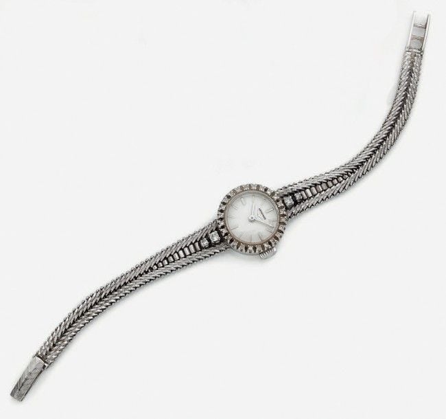 BRACELET MONTRE ronde de dame en or gris (750 millièmes
