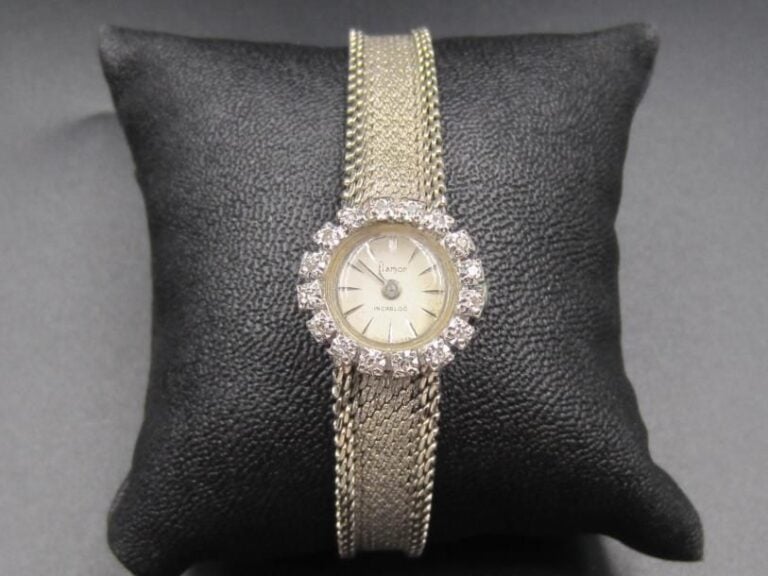 BRACELET MONTRE ronde de dame en or gris (750 millièmes