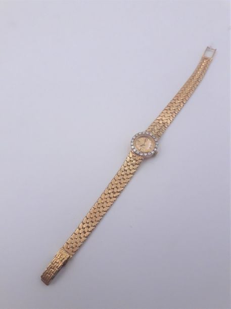 BRACELET MONTRE ronde de dame en or jaune (750 millièmes