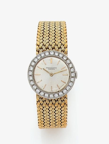•BRACELET MONTRE ronde de dame en or jaune et or gris (750‰