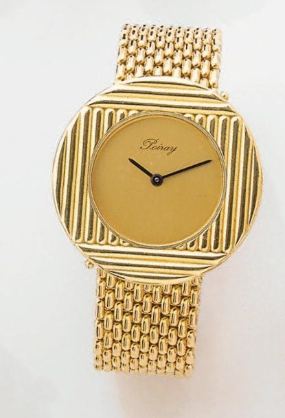 BRACELET MONTRE ronde de dame en or jaune godronn
