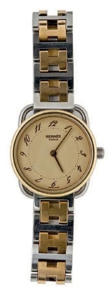 BRACELET MONTRE ronde en acier et métal doré, modèle «Arceau
