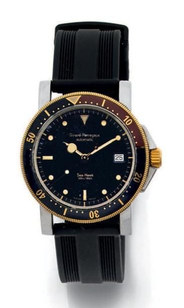 BRACELET MONTRE ronde, en or jaune (750 millièmes) et acier, modèle «Sea Hawk